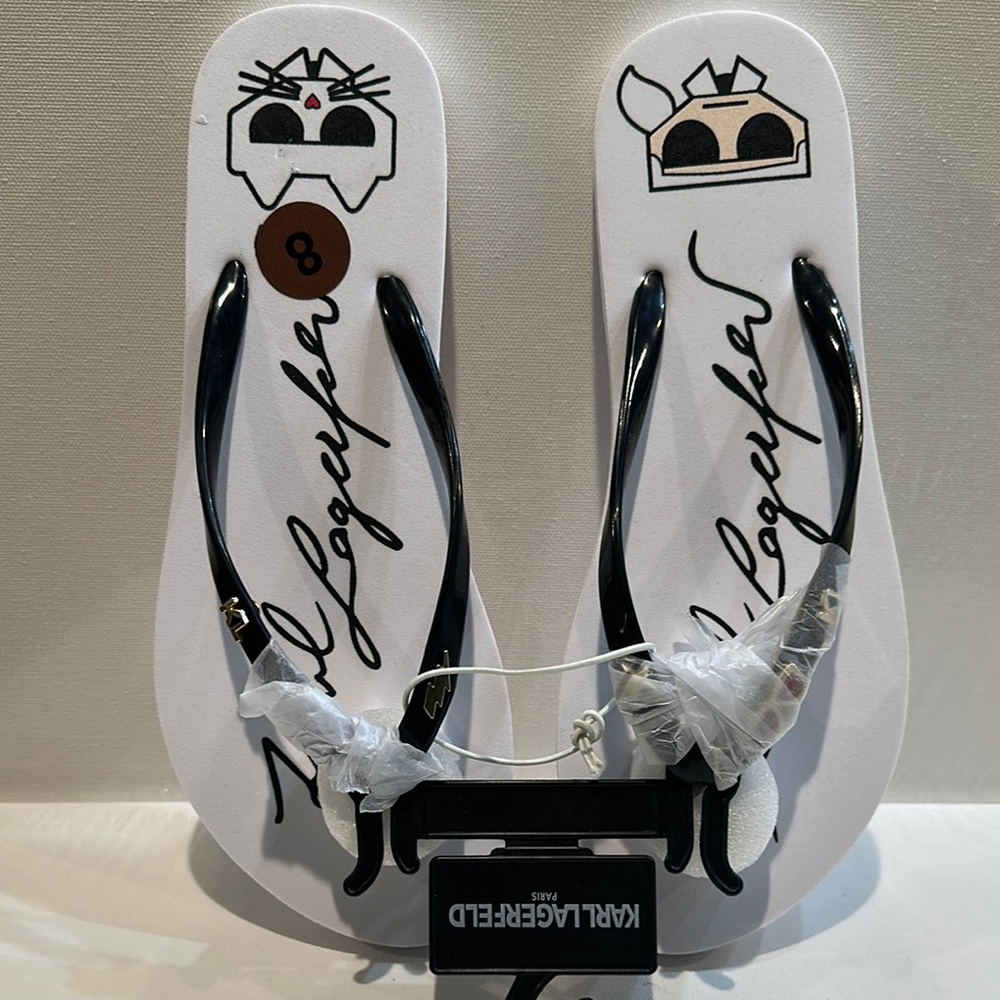 Karl Lagerfeld Black & White Slippers with ornaments attached on the straps.